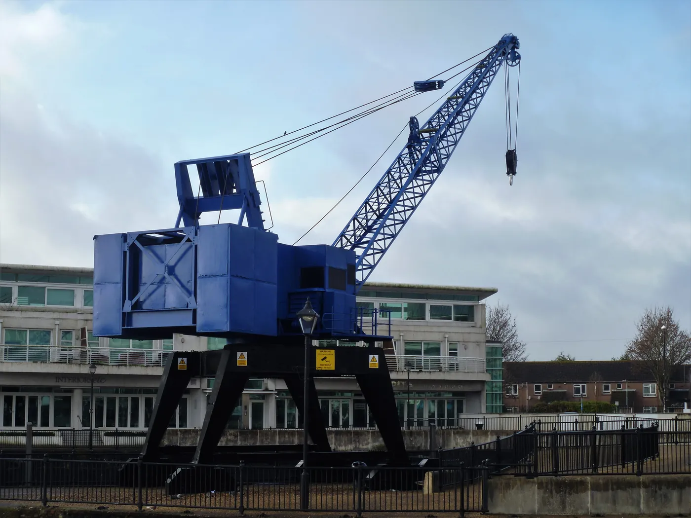 The preserved blue dock crane in front of Sovereign Quay